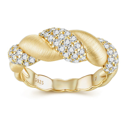 Gold ring with diamond accents on a white background