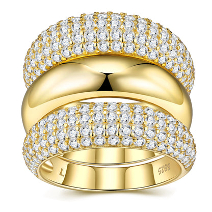 Gold ring with diamond accents on a white background