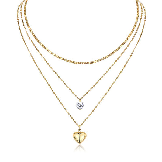 Three gold necklaces with heart and round pendants on a white background